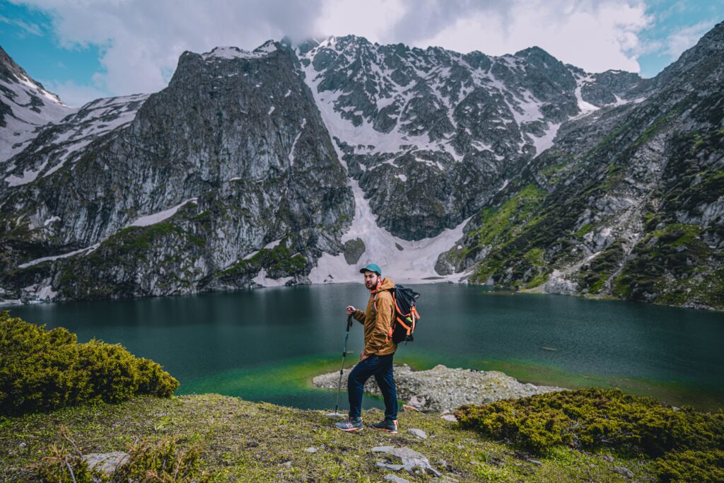 Adventure traveler hiking, covered by World Nomads insurance for high-risk activities