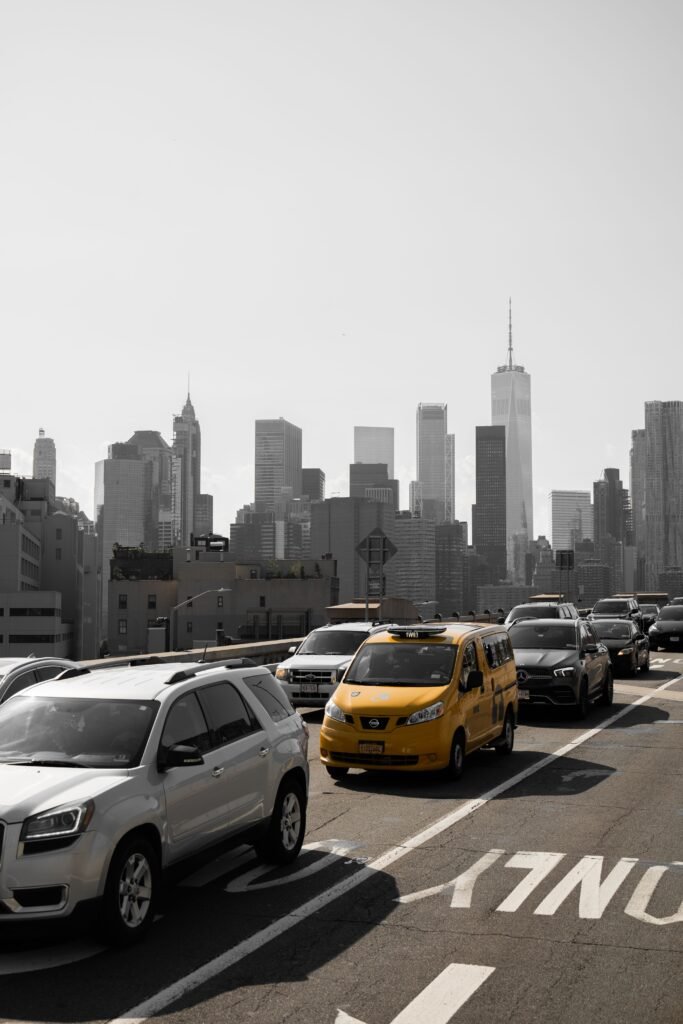 Airport transfer van driving toward the Manhattan skyline from JFK.
