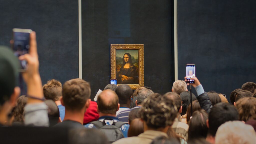 The famous Mona Lisa painting inside the Denon wing of the Louvre Museum with manageable crowds.