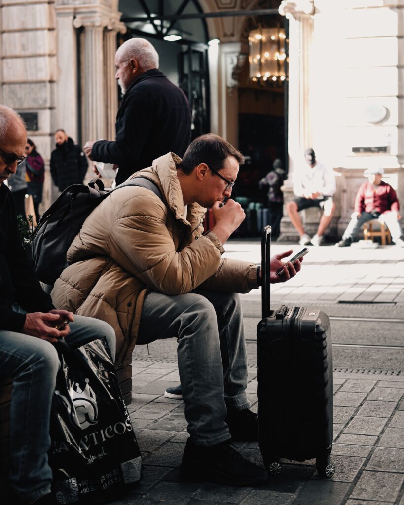 Traveler checking travel insurance details on a smartphone.