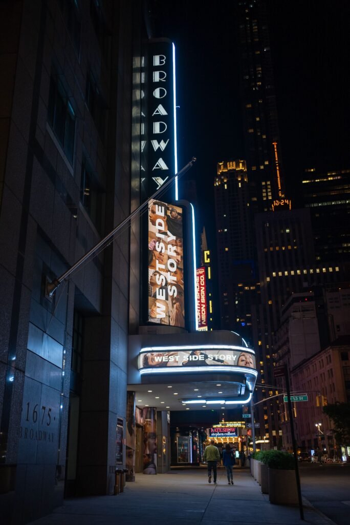 Broadway theater marquees lit up in Times Square at night